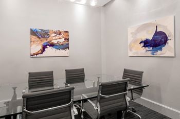 Add sophisticated business center with private spaces